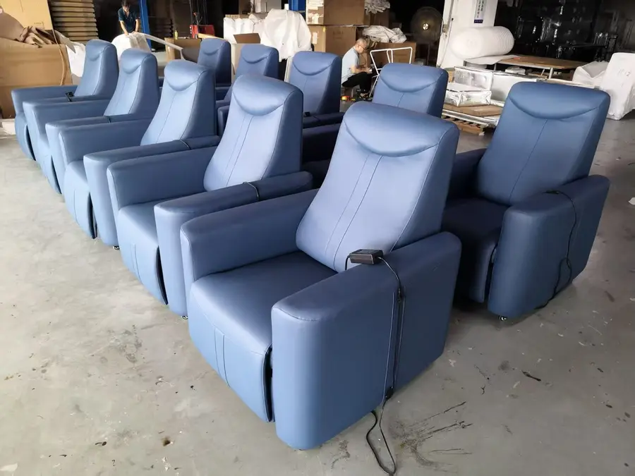 Blue medical infusion recliner chairs in factory production area